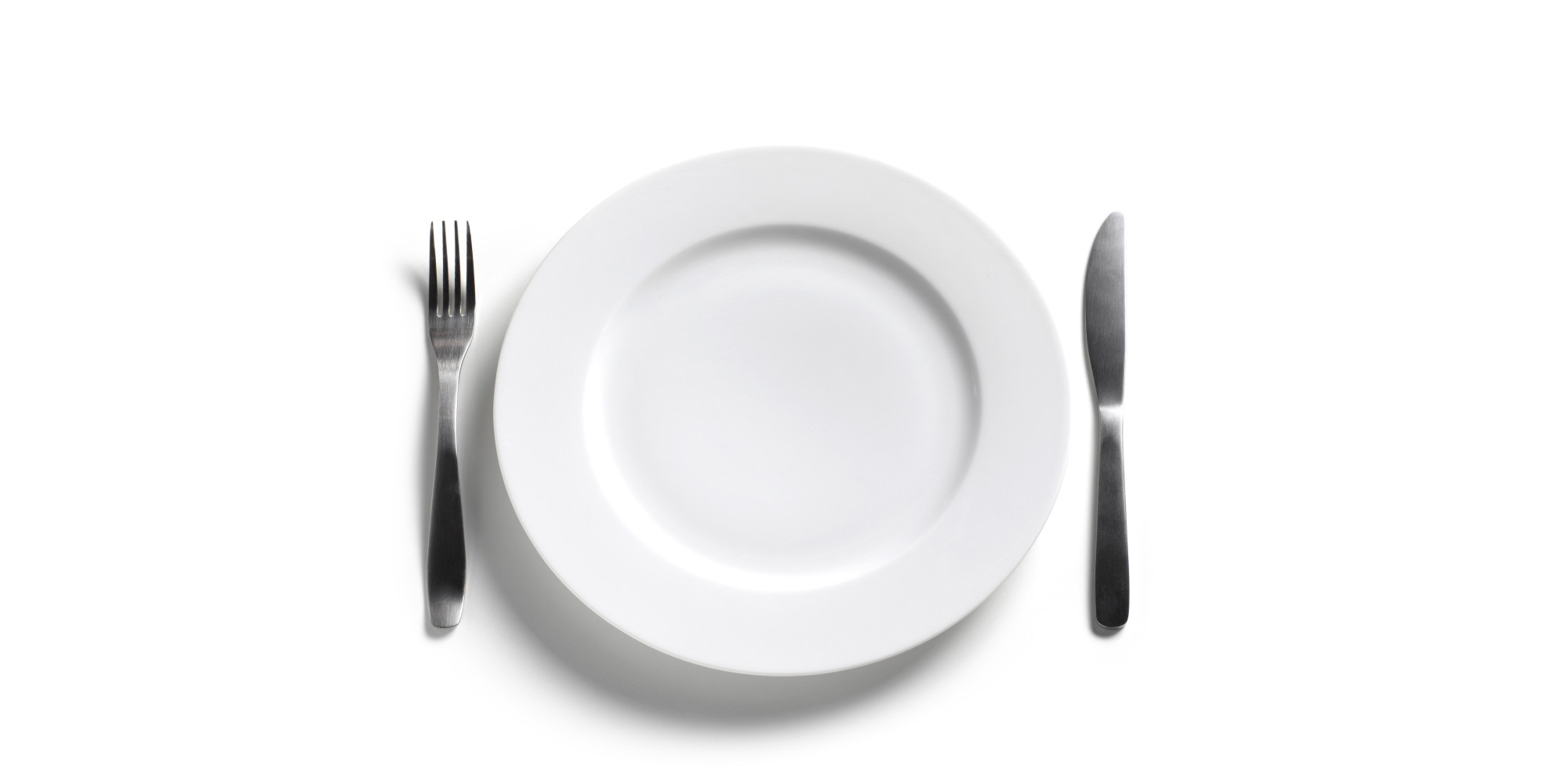 Empty dinner plate on white background